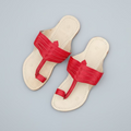 Pair of red kolhapuris with special niira packaging